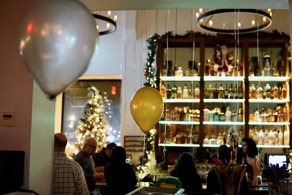 festive bar with holiday lights and balloons