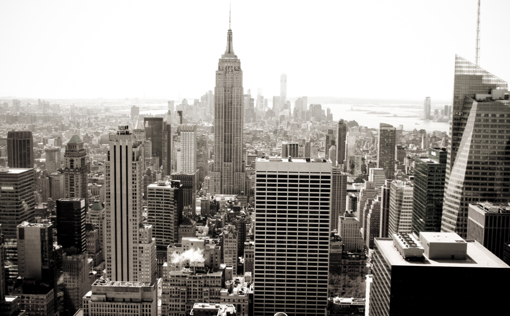 Black and white view of Manhattan skyline with Empire State Building in the center.