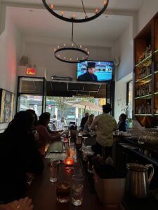 Lively bar showing the moving French Connection on the TV