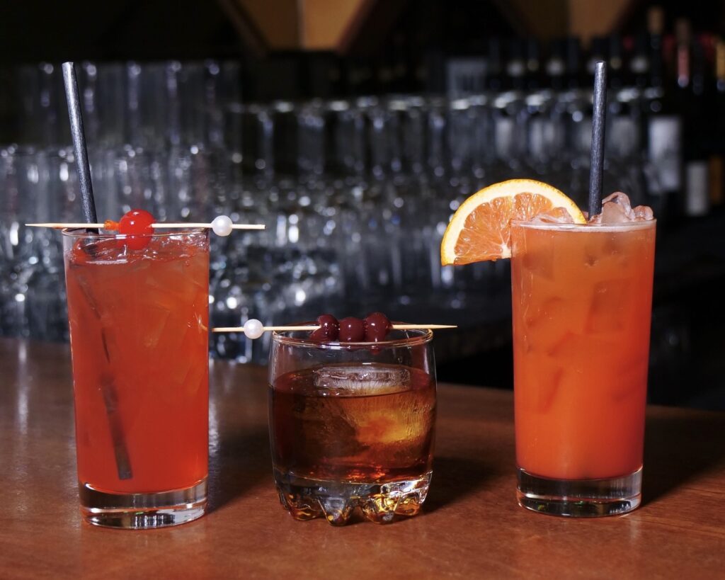 three colorful rum drinks